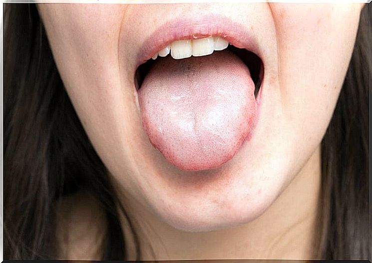 Woman sticks out tongue