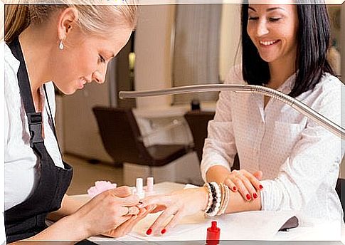 Woman makes manicure and acrylic nails