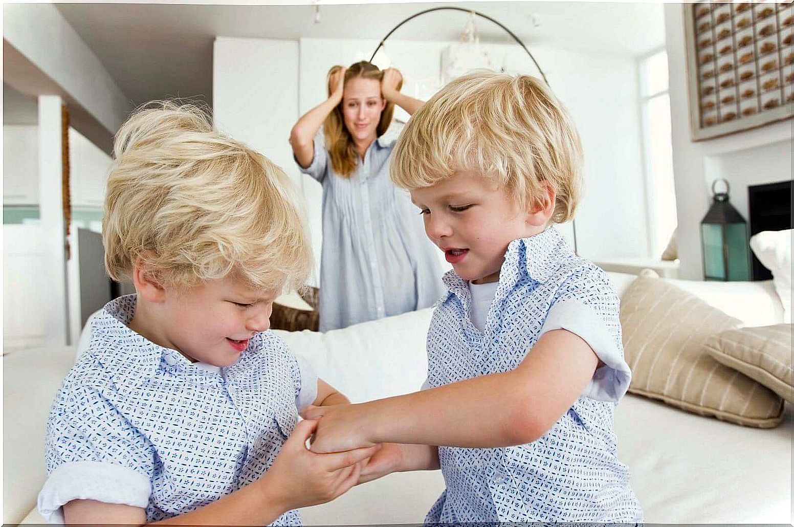 Mother with two arguing children